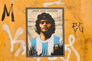 A mural dedicated to Diego Armando Maradona, by street artist Harry Greb is seen in the Trastevere district of Rome, on November 27, 2020. - The Argentine football legend died of a heart attack on November 25, 2020 at the age of 60. (Photo by Alberto PIZZOLI / AFP) / RESTRICTED TO EDITORIAL USE - MANDATORY MENTION OF THE ARTIST UPON PUBLICATION - TO ILLUSTRATE THE EVENT AS SPECIFIED IN THE CAPTION / The erroneous mention[s] appearing in the metadata of this photo by Alberto PIZZOLI has been modified in AFP systems in the following manner: [-RESTRICTED TO EDITORIAL USE - MANDATORY MENTION OF THE ARTIST UPON PUBLICATION - TO ILLUSTRATE THE EVENT AS SPECIFIED IN THE CAPTION ] instead of [---]. Please immediately remove the erroneous mention[s] from all your online services and delete it (them) from your servers. If you have been authorized by AFP to distribute it (them) to third parties, please ensure that the same actions are carried out by them. Failure to promptly comply with these instructions will entail liability on your part for any continued or post notification usage. Therefore we thank you very much for all your attention and prompt action. We are sorry for the inconvenience this notification may cause and remain at your disposal for any further information you may require. (Photo by ALBERTO PIZZOLI/AFP via Getty Images)